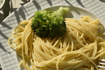 close up portion of spaghetti with broccoli 