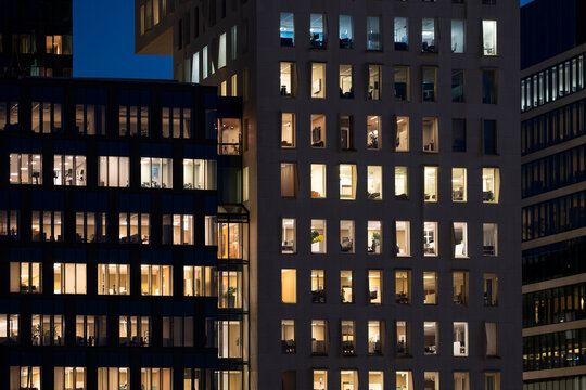 Urban skyline of Oslo&rsquo;s Barcode district with glass facade architecture and bright night light reflections creating a modern city atmosphere filled with building geometry