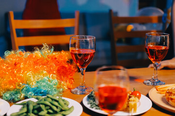 Joyful office Halloween party with coworkers in costumes, celebrating with drinks and laughter, fostering teamwork and festive spirit