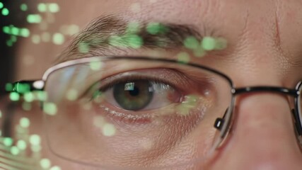 Closeup of a mans eye behind glasses reflecting digital data and green glowing particles symbolizing advanced technology artificial intelligence and data analysis in a futuristic context. - Powered by Adobe
