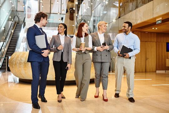 Professionals engaging in conversation in a sleek modern office space during a business meeting - Powered by Adobe