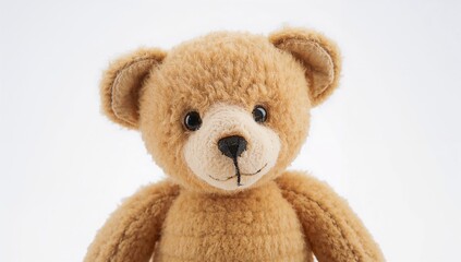 Obraz premium Teddy Bear on a plain white backdrop, suitable for children's themes