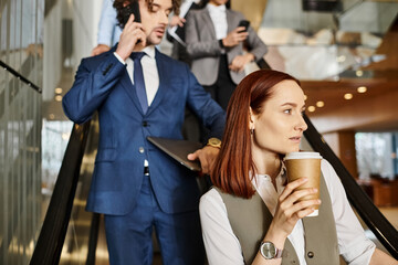 Business professionals engaged in dynamic discussions in a modern office environment