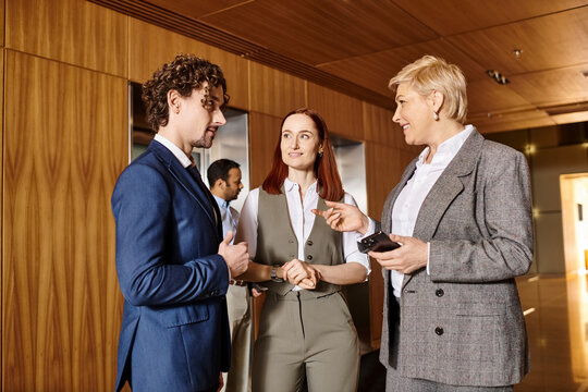 Engaging discussions among colleagues in a modern office setting during a business meeting
