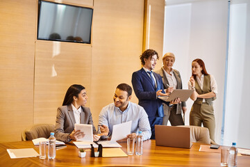Collaboration in a modern office setting with a diverse business team sharing ideas