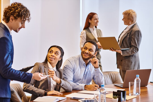 Engaging discussions in a modern office setting with diverse professionals collaborating
