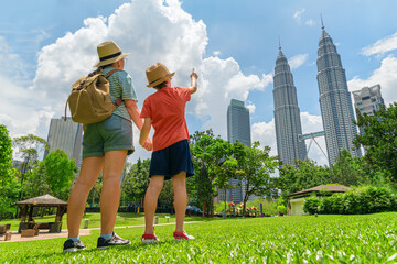 Female tourist and her son enjoying cityscape of Kuala Lumpur