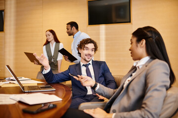 Engaging business discussions in a modern office environment among diverse professionals