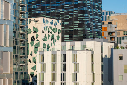 Structure and geometry of modern architecture skyline reflecting in Oslo building glass creating urban pattern with balanced design and soft evening atmosphere