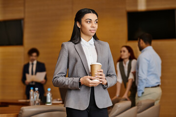 Professional gathering in a modern office setting with motivated individuals engaging in discussions