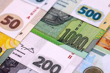 Congolese franc money bills in big amount on table close up. Rich life concept in Democratic Republic of Congo. Business and economy