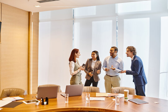 Group of professionals collaborating in a bright modern office space during a productive meeting