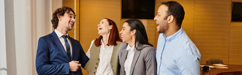 Lively conversation and laughter among colleagues in a modern office setting