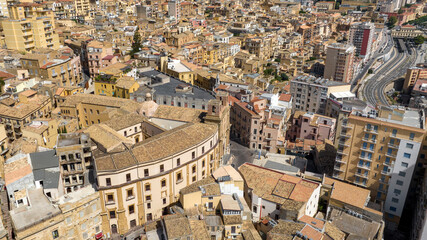 Aerial view of houses, roofs and buildings in the historic center of Agrigento, Sicily, Italy. The Sicilian capital, located on a hilltop,was known in ancient times as Akragas. It's a sunny summer day