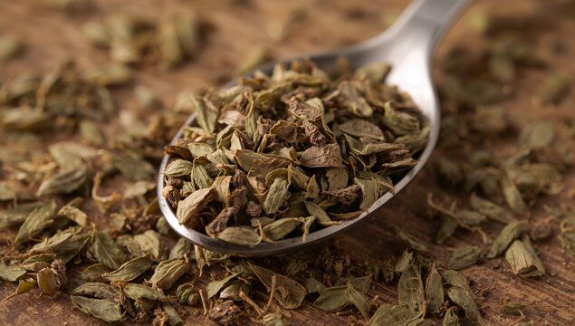 Dried green oregano close-up, a flavorful herb that enhances dishes, culinary enrichment