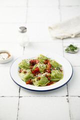 Spinach ravioli with sun dried tomatoes