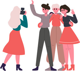 Woman photographing a group of friends posing together