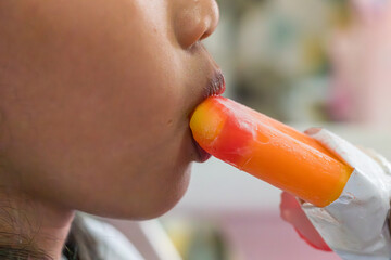 A little girl enjoying an ice cream