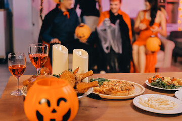 Joyful office Halloween party with coworkers in costumes, celebrating with drinks and laughter, fostering teamwork and festive spirit