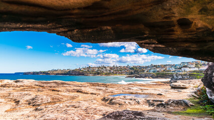 Tamarama coastal cliffs and scenic walk with blue ocean view on a bright day, Sydney, Australia