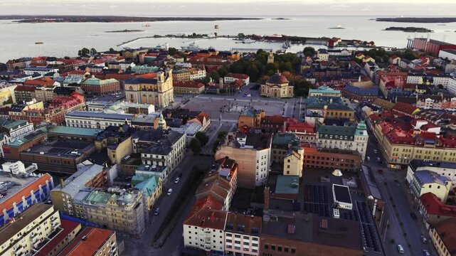 Aerial view of the impressive Kalmar Cathedral and Stortorget square, contrasting against the vivid rooftops, Kalmar, Kalmar County, Sweden.