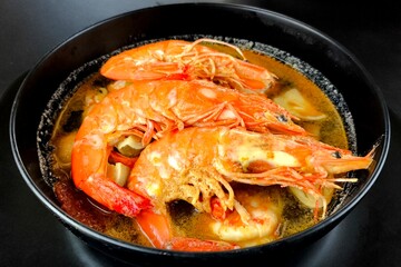 Prawn soup or Tomyam Kung in bowl, Thai famous food.