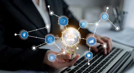 A professional engages with a laptop, representing digital innovation and transformation in a...