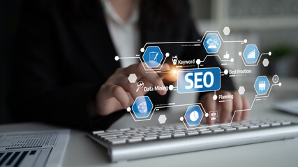 Naklejka premium A business professional engages with SEO strategies by using digital tools, highlighting essential aspects like keyword research and data analysis for online success. Tessel