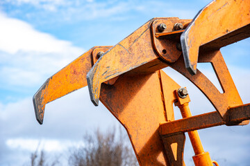 The powerful claw of a forestry or agricultural machine.