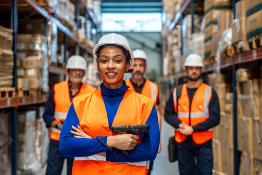 Diverse logistics warehouse team working in distribution center
