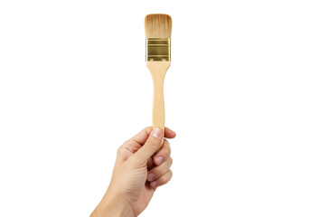 Isolated hand holding a small paintbrush, ready to paint or apply stain to a surface