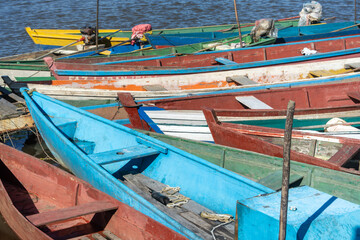 Colorful Wooden Fishing Boats Docked at the Shore