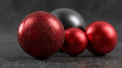 Shiny Christmas balls and red decoration on dark background.