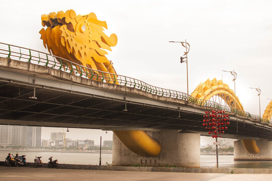dragon bridge in danang viewed from sidewalk below