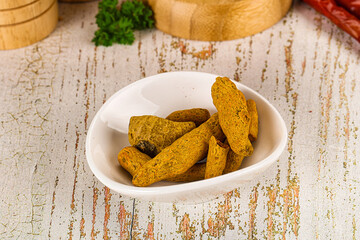 Raw dry Tumeric roots heap