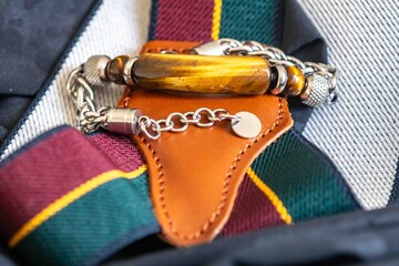 Wonderful men's bracelet made of tiger's eye stone with 925 silver. A semi-precious gemstone from the quartz group, with golden and brown tones and a silky sheen that resembles a tiger's eye.	
