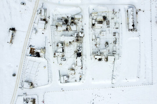 Aerial view of snow-covered buildings and structures create a stark, wintry scene, the landscape blanketed in white, Bihać, Federation of Bosnia and Herzegovina, Bosnia and Herzegovina.