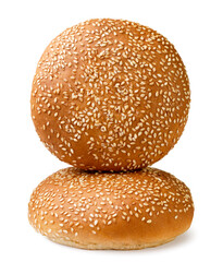 Two burger buns with sesame seeds on a white background. Isolated