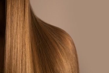 Long, straight, shiny dark blond hair. Keratin straightening. Healthy, natural hair with copy space