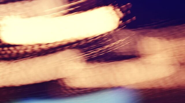 Slow shutter speed footage with motion blur and smeared colorful bokeh circles from street lights at night, abstract dreamy background. 4K