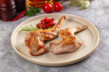 Roasted rabbit leg served rosemary