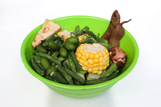 ingredients for cooking Indonesian sour soup (sayur asem) consists of corn, string bean, melinjo (gnetum gnemon) leaf, melinjo, young papaya, and labu siam (sachium edule).