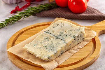 Tasty Italian gorgonzola cheese over board