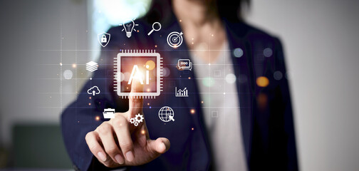 Businessperson touching virtual AI icon on a digital interface with technology symbols, representing artificial intelligence, innovation, data analysis, machine learning, and digital transformation.
