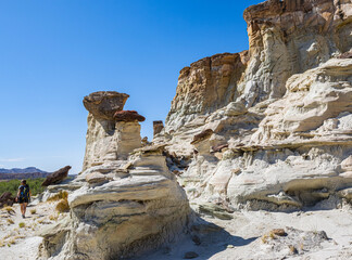 Female Hiker With White Hoodoos and Sandstone Cliffs on The Wahweap Hoodoos Trail, Grand Staircase-Escalante National Monument, Utah, USA