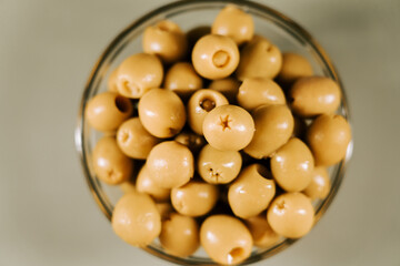 Fresh olives in a clear bowl ready for snacking or cooking in a sunny kitchen