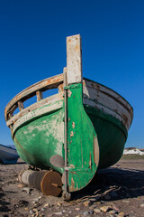 old abandoned wooden boat on the beach, an old shipwreck boat abandoned stand on beach or Shipwrecked off the coast of El Alquian, Almeria, Andalusia, Spain, old rusty wooden boat