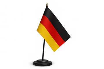 German flag standing on a desk with a golden finial, representing nation, patriotism, and international relations