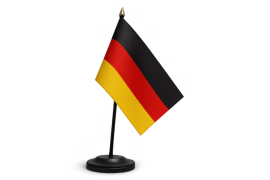 German flag standing on a desk with a golden finial, representing nation, patriotism, and international relations