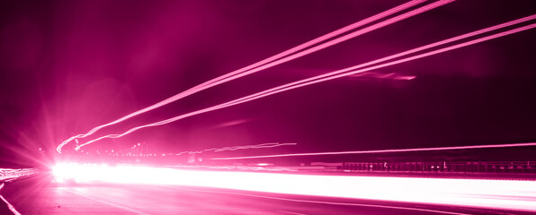 violet car lights at night. long exposure